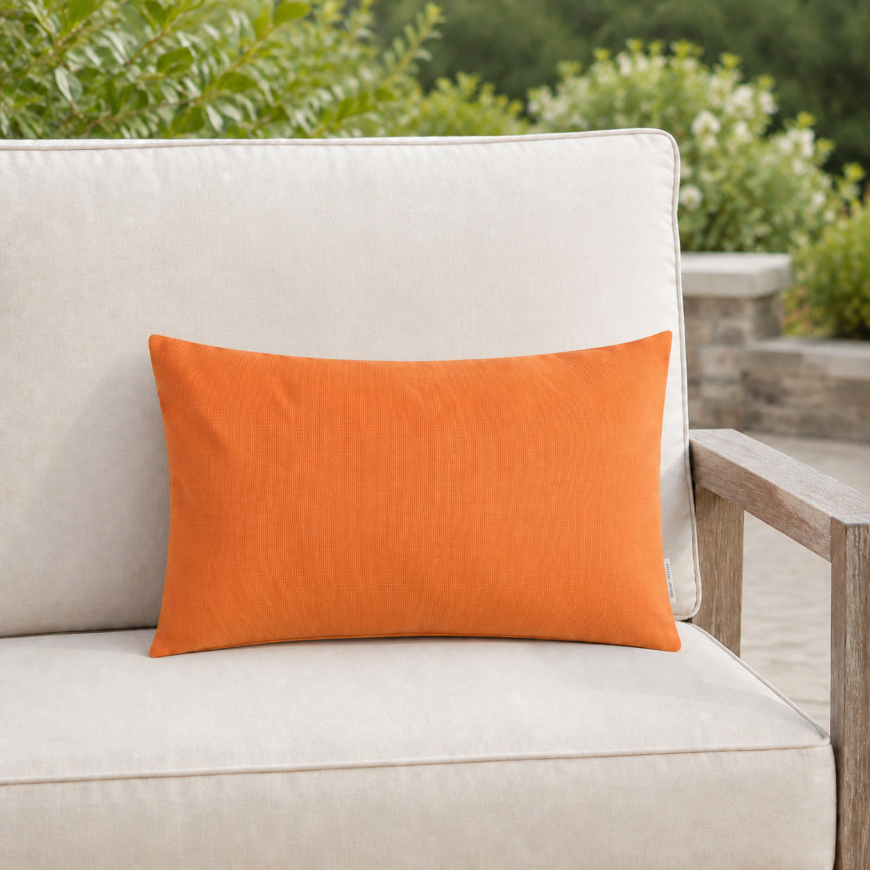 Sunbrella Outdoor Solid Pillow - Citrus Orange - 12x20 rectangular pillow - lifestyle