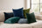 Castello velvet pillows in blue and green on a cream sofa